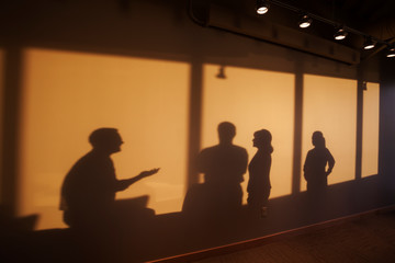 Shadows of business people.