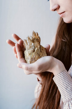 Woman holding gemstone on her hand
