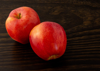 Fototapeta na wymiar apples on dark wood background