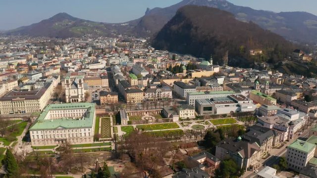 Aerial view of famous Mirabell Gardens with historic Hohensalzburg Fortress in the background on a sunny day in fall in Salzburg, Austria