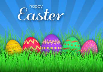 Colorful Easter eggs on green grass