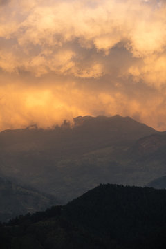 Orange clouds over the Knuckles mountain ridge