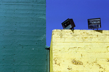 green and yellow concrete walls and blue sky