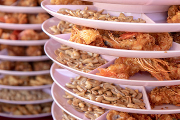 Shrimp and crispy fried beans in a tray.