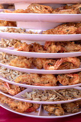 Shrimp and crispy fried beans in a tray.