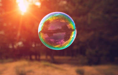 soap bubbles into the sunset with beautiful bokeh.close-up