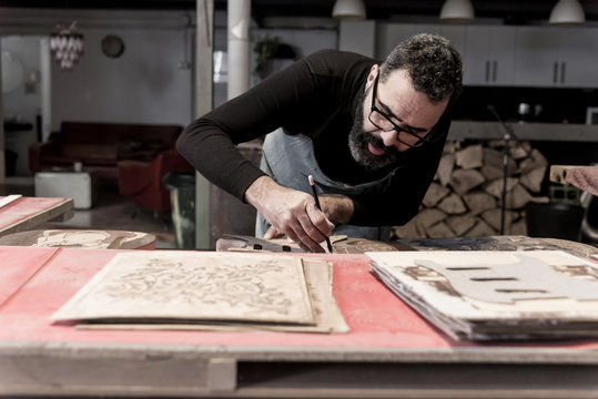 Guitar luthier working in his workshop
