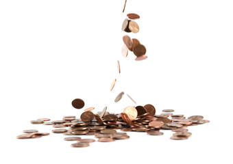Coins falling down into pile isolated on white
