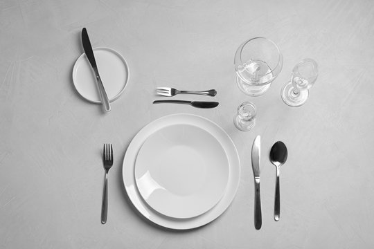 Stylish elegant table setting on light background, top view
