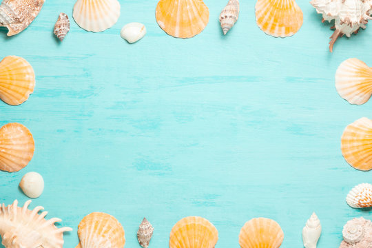 Blue sea background with copy space and seashell border, summer holiday and vacation concept