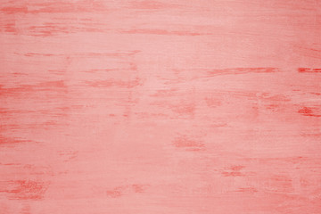 Old wooden board painted with coral paint, background, texture
