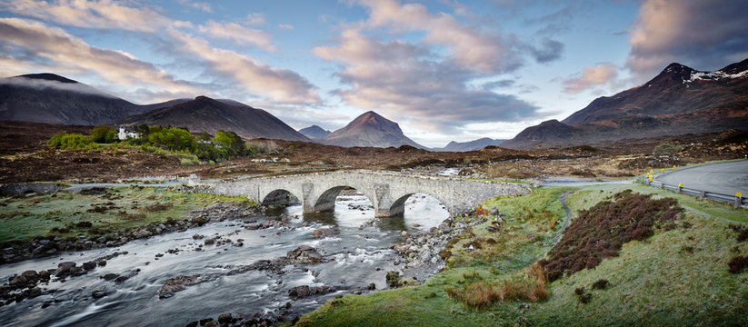 Old Stone Bridge near a Mountain Range