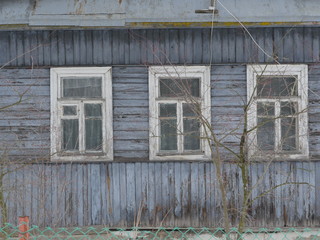 windows of an aged wooden farmhouse