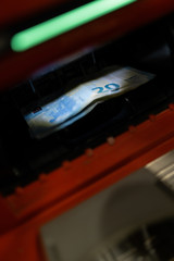 20 euro banknotes at ATM machine in the bank in Shopping centre