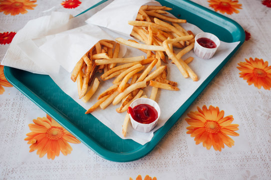 Fries and sauce on a tray