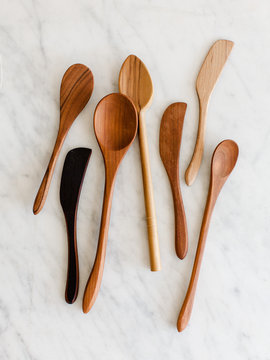 Wooden spoons on marble countertop