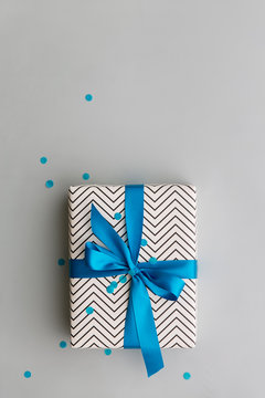 Gift tied with a blue ribbon