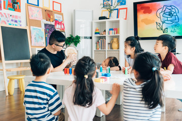 Teacher and students in art class