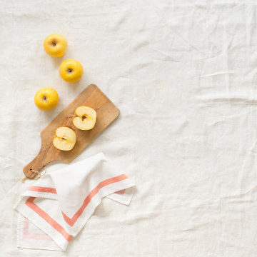 Opal Yellow Apples on a Table