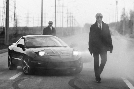Aliens and a car on the abandoned road