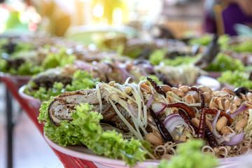 Fried snakehead fish with spicy and sour taste.