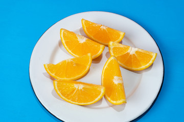 Fototapeta na wymiar Orange slices on colorful background