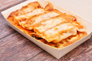 Fired dumpling in takeout food box 