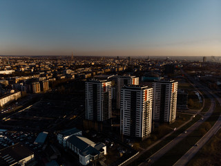 Aerial dramatic scenery sunset with a view over skyscrapers in Riga, Latvia - Old Town downtown is visible in the background