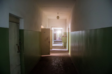 Dark creepy corridor of abandoned building