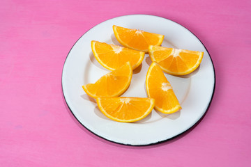 Orange slices on colorful background