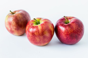 Three red apples