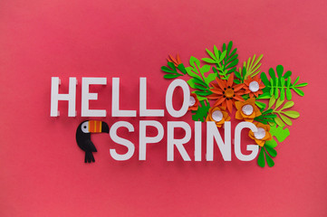 Fototapeta na wymiar Hello Spring May hand lettering card. Spring tulip narcissus, plumeria paper craft flowers on dark pink background.