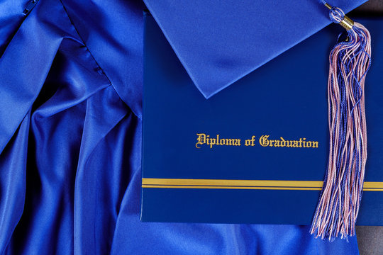 Graduation hat and diploma certificate front view