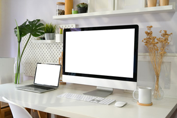 Blank screen desktop computer on loft workspace