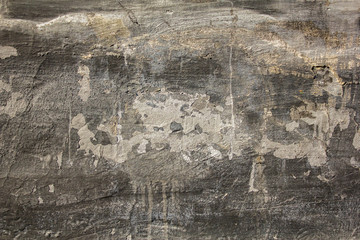 dirty old gray white black shabby concrete wall with severe damage and scratches. rough surface texture