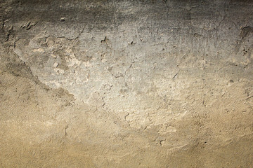 old gray white black shabby concrete wall with severe damage and scratches. rough surface texture