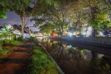 River on the edge of town Night photo Location of poor East Java Indonesia