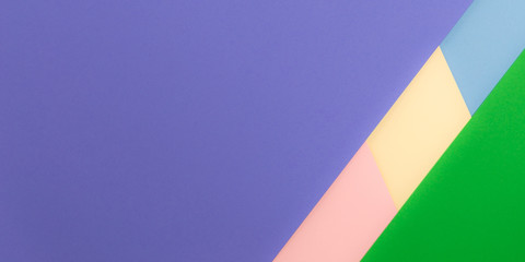 Vibrant multicolor background from cardboard of different colors. Color paper for background. Colorful abstract geometric shapes. Minimalist design for minimal background. Colorful background.