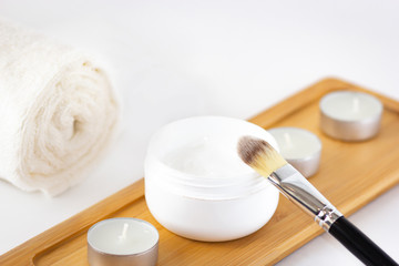 Cosmetics flat lay on white background