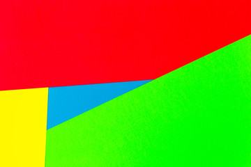 Vibrant multicolor background from cardboard of different colors. Color paper for background. Colorful abstract geometric shapes. Minimalist design for minimal background. Colorful background.