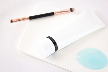 Cosmetics flat lay on white background