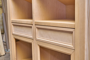 Production of wood furniture. Wardrobe with drawers. Furniture manufacture. Close-up