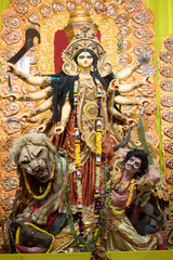 Fototapeta na wymiar KOLKATA, INDIA - OCTOBER 7, 2016: Potrait Of Goddess Durga idol at a South Kolkata famous Durga puja temple (pandal) on 