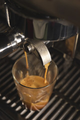 close up of coffee machine preparing cup of coffee