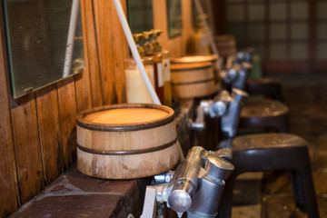 Japanese traditional style public shower room or "Onsen". Bucket Japanese Hot Spring