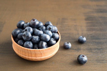 Fresh useful blueberries on a black background.