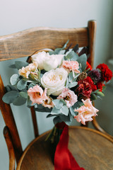 A bright modern bouquet on a white background. Wedding decor and minimalism.