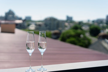 Two glasses of champagne on the roof