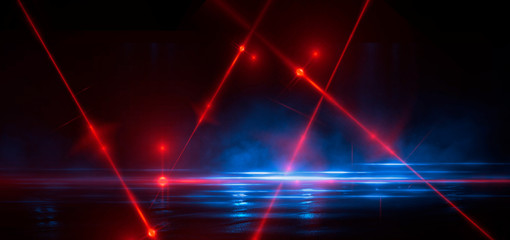 Dark street, reflection of neon light on wet asphalt. Rays of light and red laser light in the dark. Night view of the street, the city. Abstract dark blue background.