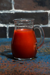 fresh tomato juice in a glass jug